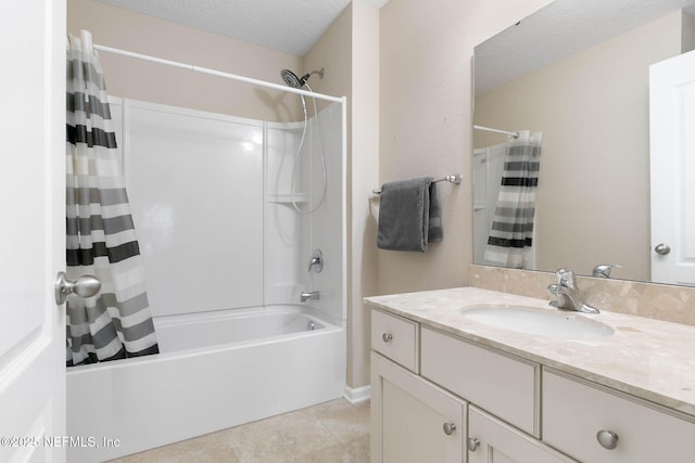 bathroom featuring vanity, shower / tub combo, and a textured ceiling