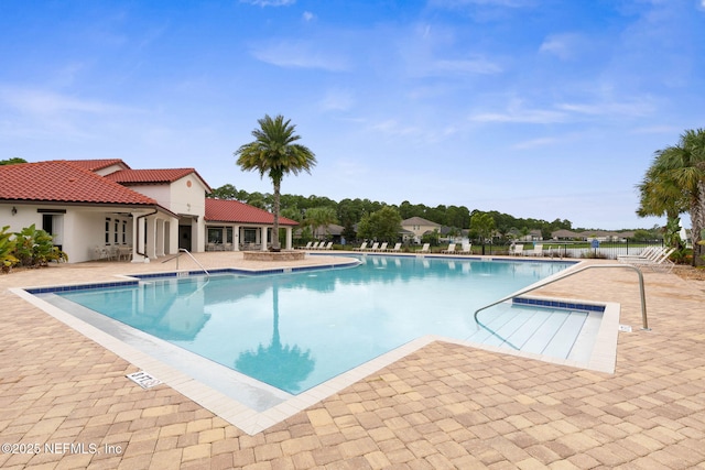 view of pool featuring a patio