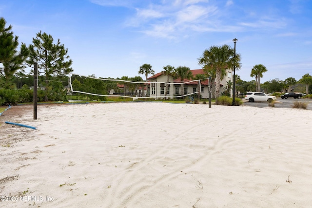 surrounding community featuring volleyball court