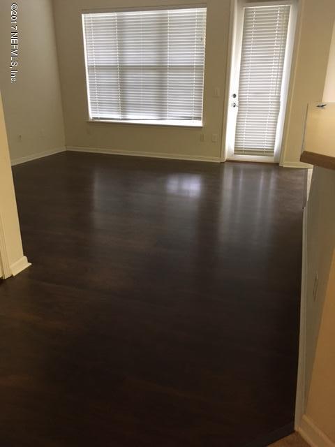 empty room with dark wood-type flooring