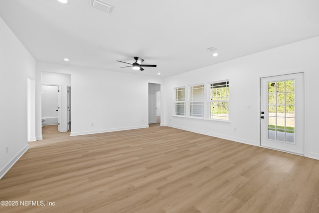 unfurnished living room featuring ceiling fan and light hardwood / wood-style floors