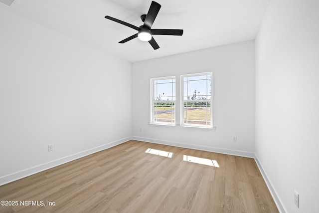 empty room featuring ceiling fan and light wood-type flooring