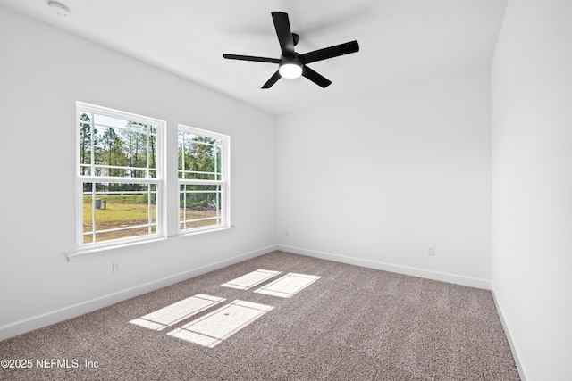 unfurnished room with ceiling fan and carpet floors