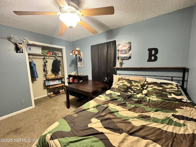 bedroom with carpet, ceiling fan, a textured ceiling, and a closet