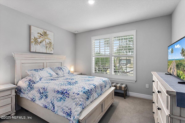 carpeted bedroom with a textured ceiling