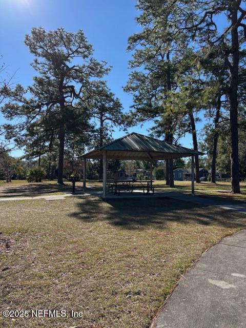 surrounding community featuring a gazebo and a yard