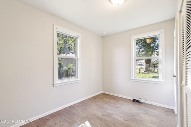 empty room with light wood-type flooring