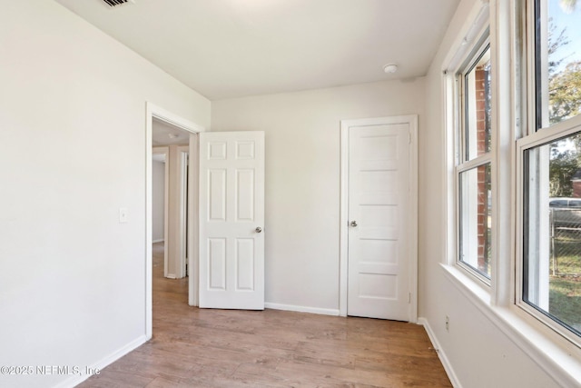 unfurnished bedroom with light hardwood / wood-style flooring