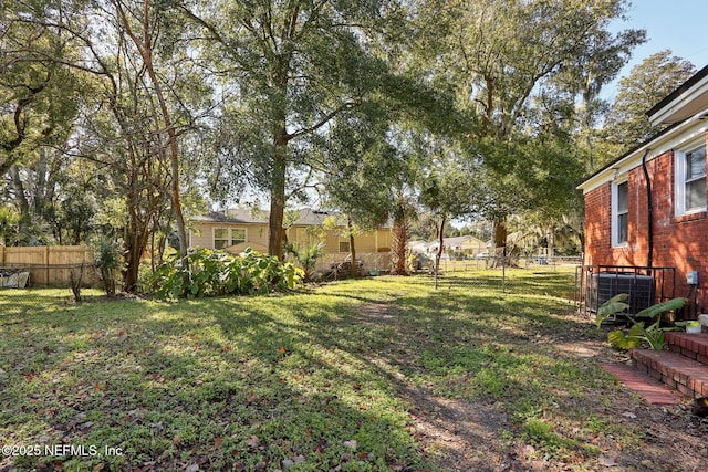 view of yard with central AC unit