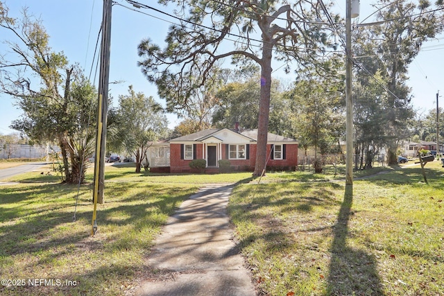 single story home featuring a front yard