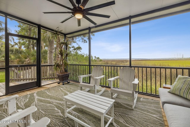 sunroom with ceiling fan and a healthy amount of sunlight