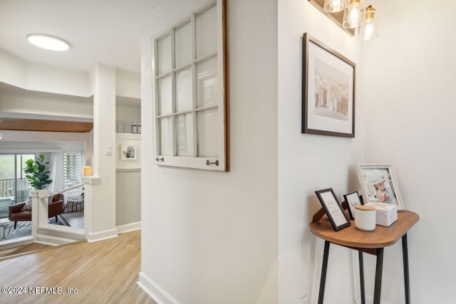 hall with light hardwood / wood-style flooring