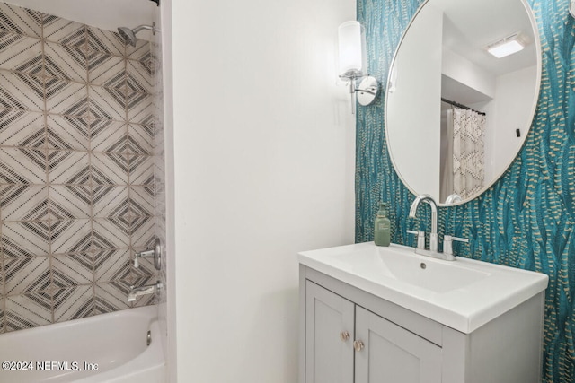 bathroom with vanity and shower / bath combo