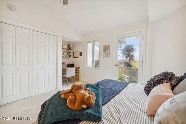 bedroom with access to outside, light carpet, a closet, and high vaulted ceiling