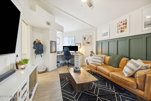 living room with ceiling fan and light hardwood / wood-style floors