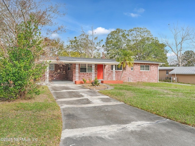 ranch-style house with a front lawn and a carport