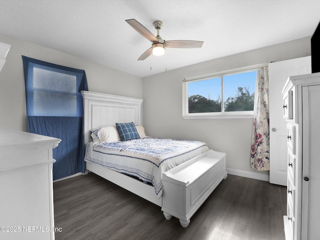 bedroom featuring a textured ceiling, dark hardwood / wood-style flooring, and ceiling fan