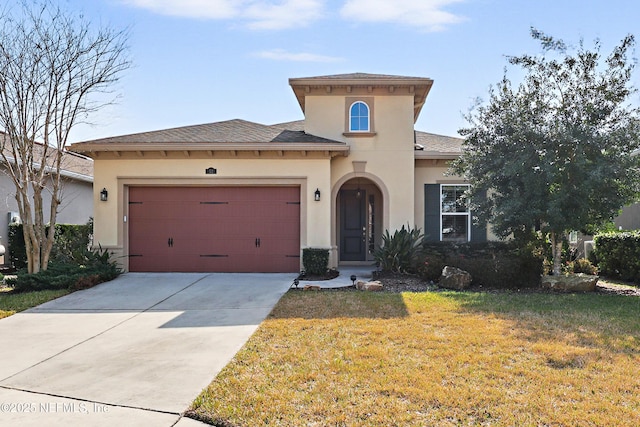 view of front of house featuring a garage and a front yard