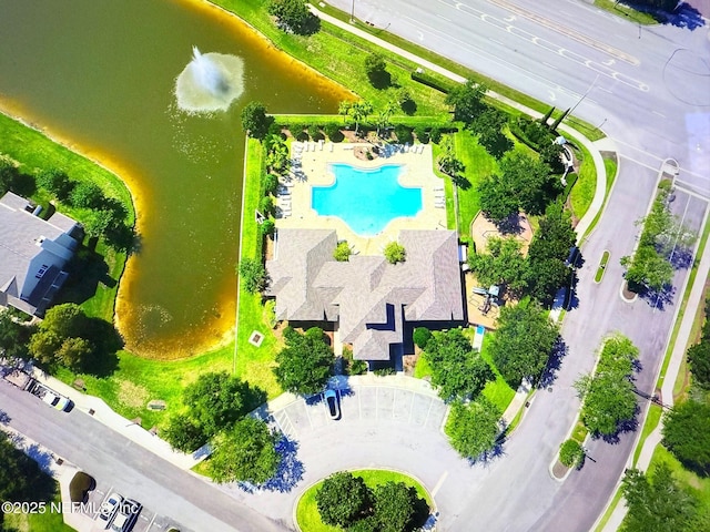 birds eye view of property with a water view