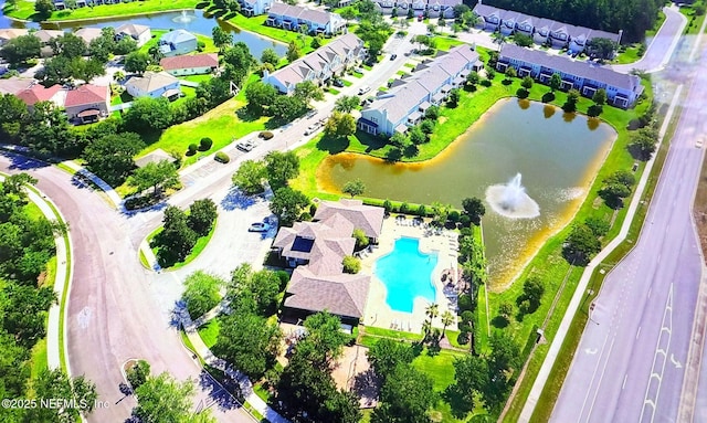 bird's eye view featuring a residential view and a water view