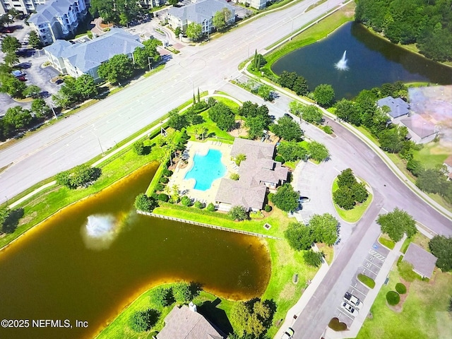 drone / aerial view with a water view