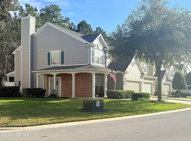 view of front facade featuring a front yard and a garage