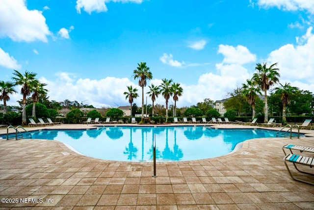 community pool featuring a patio area