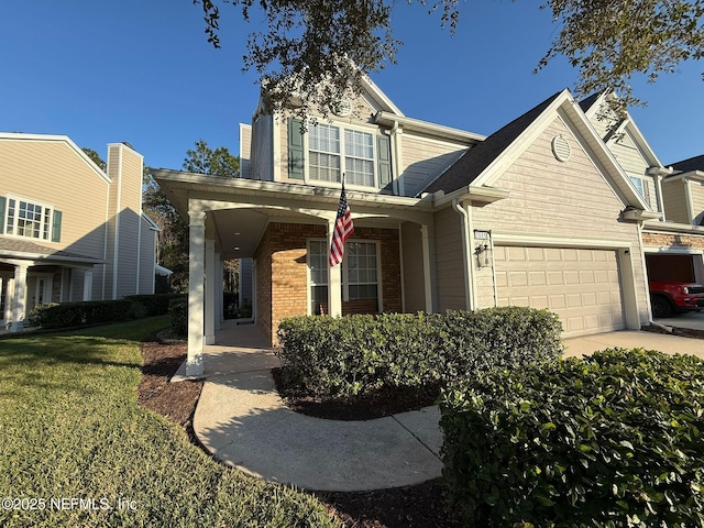 view of front facade with a garage and a front lawn