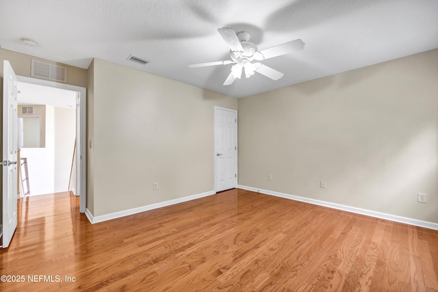 unfurnished room with visible vents, baseboards, and light wood-style flooring