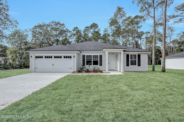 ranch-style home with a garage and a front lawn