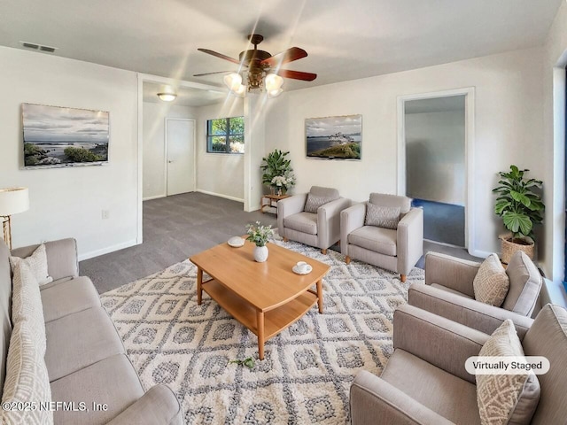 living room featuring carpet flooring and ceiling fan