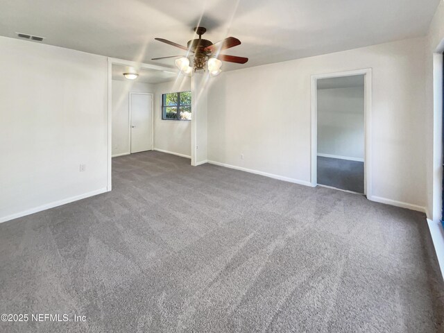 carpeted spare room with ceiling fan