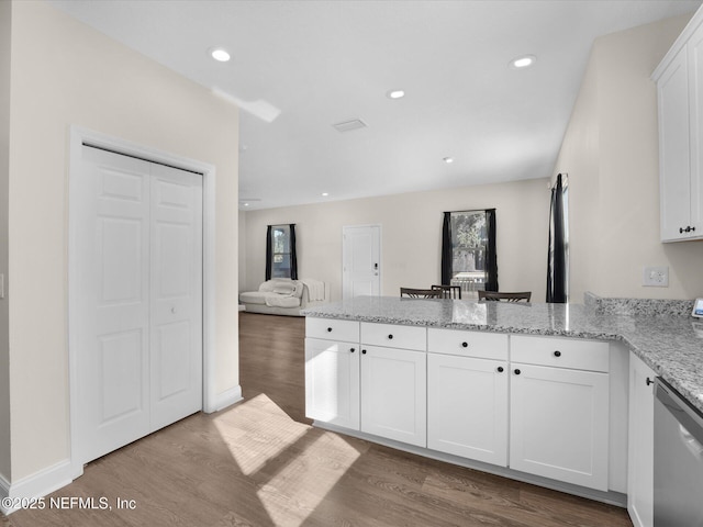 kitchen with dishwasher, light wood-type flooring, and white cabinetry