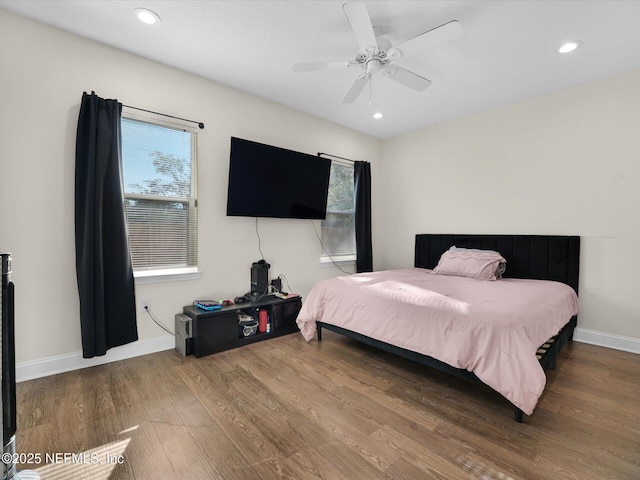 bedroom featuring hardwood / wood-style floors and ceiling fan