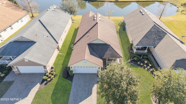 birds eye view of property featuring a water view