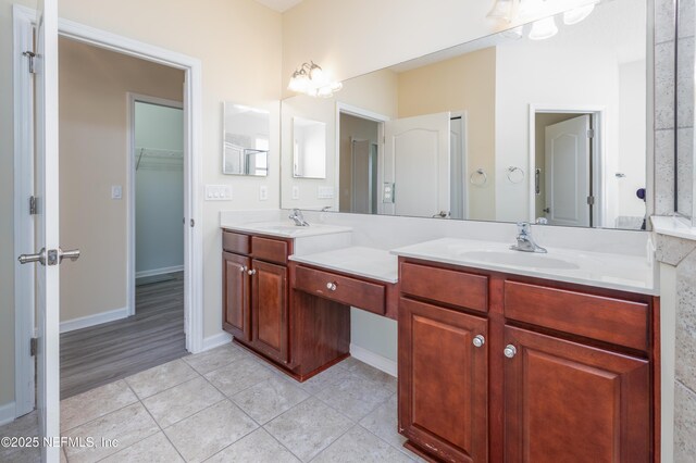 bathroom featuring tile patterned floors and vanity