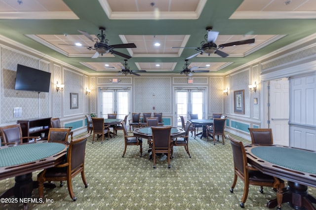 carpeted dining room featuring coffered ceiling, crown molding, and french doors