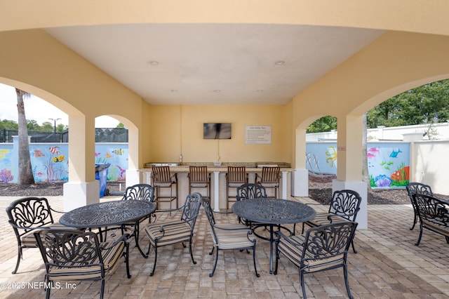 view of patio / terrace featuring exterior bar