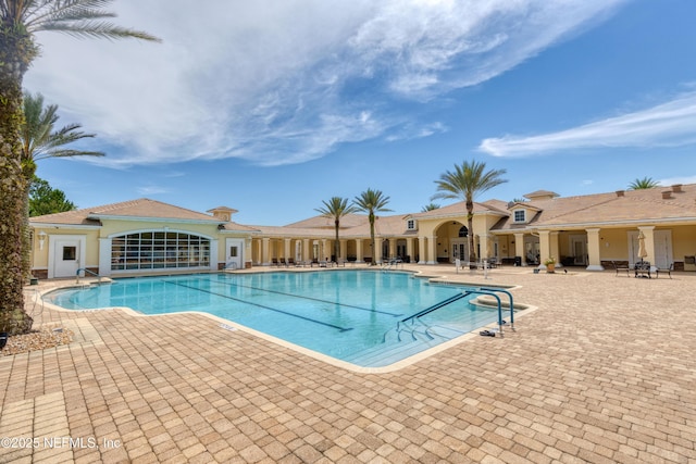 view of swimming pool with a patio area