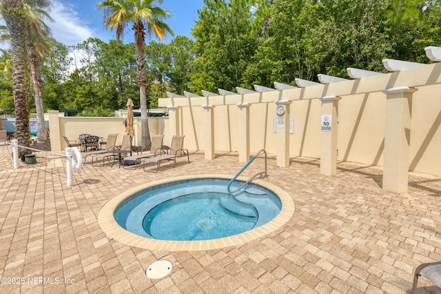 view of pool with a community hot tub and a patio