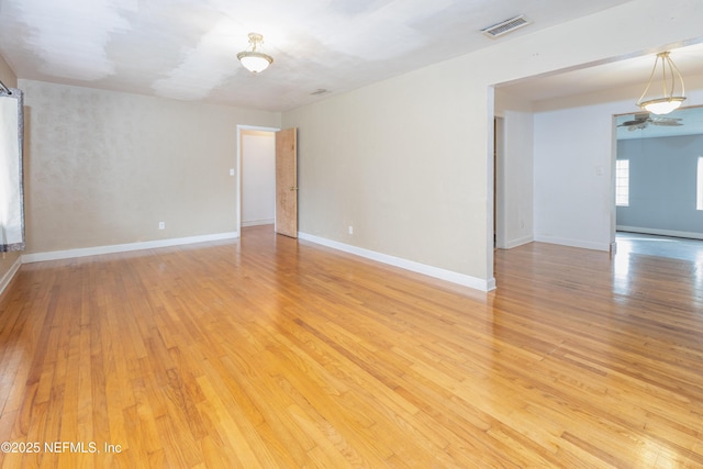 spare room with light wood-type flooring