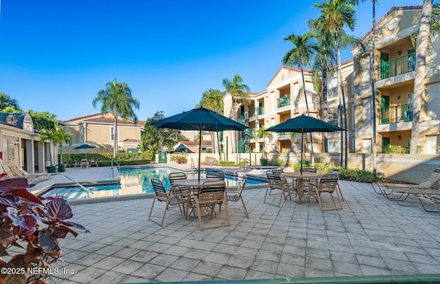 view of patio featuring a community pool