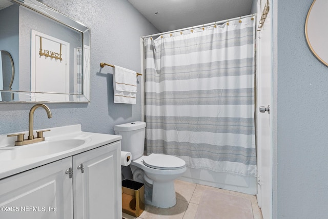 full bathroom with tile patterned floors, vanity, shower / bath combo, and toilet