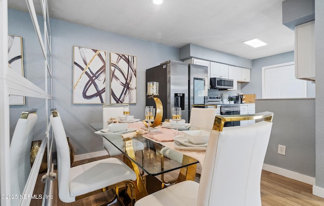 dining room with light hardwood / wood-style floors