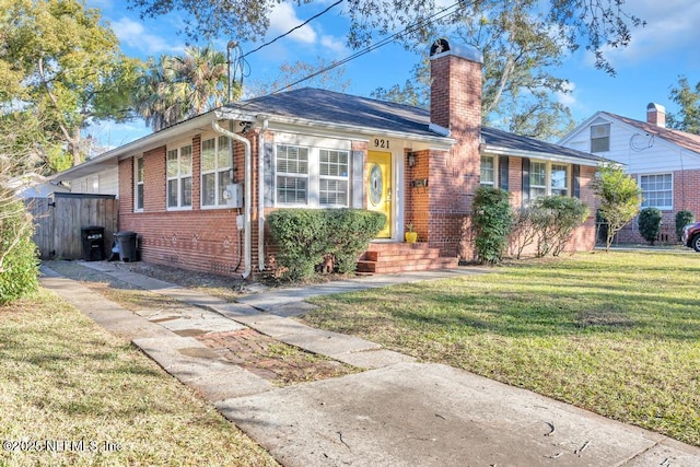 ranch-style home with a front lawn