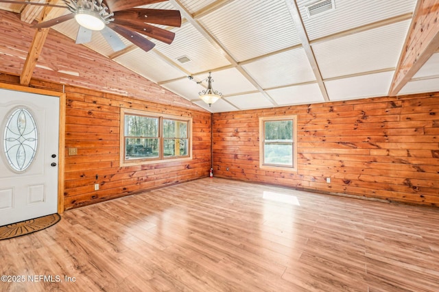 foyer entrance with lofted ceiling with beams, ceiling fan, plenty of natural light, and light hardwood / wood-style floors