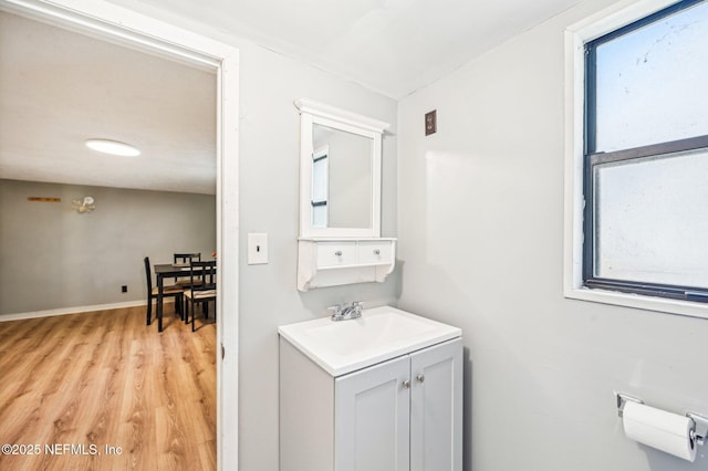 bathroom with vanity and wood-type flooring