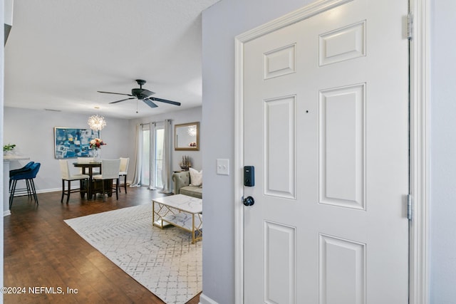 entryway with ceiling fan and dark hardwood / wood-style floors