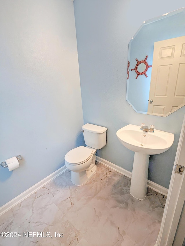 bathroom with sink and toilet