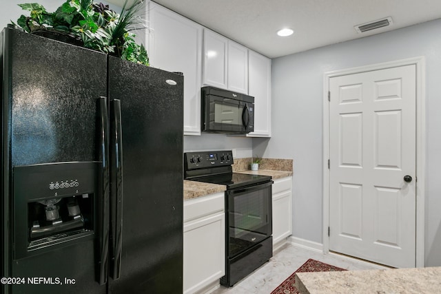 kitchen with white cabinets and black appliances